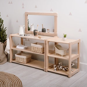 On the picture is our Type B+ washbasin shelf and our Small shelf. Both of them have 2 compartments and on the top of the washbasin is a bowl. Above the washbasin is a big mirror and also on the side is a hanger for a towel.