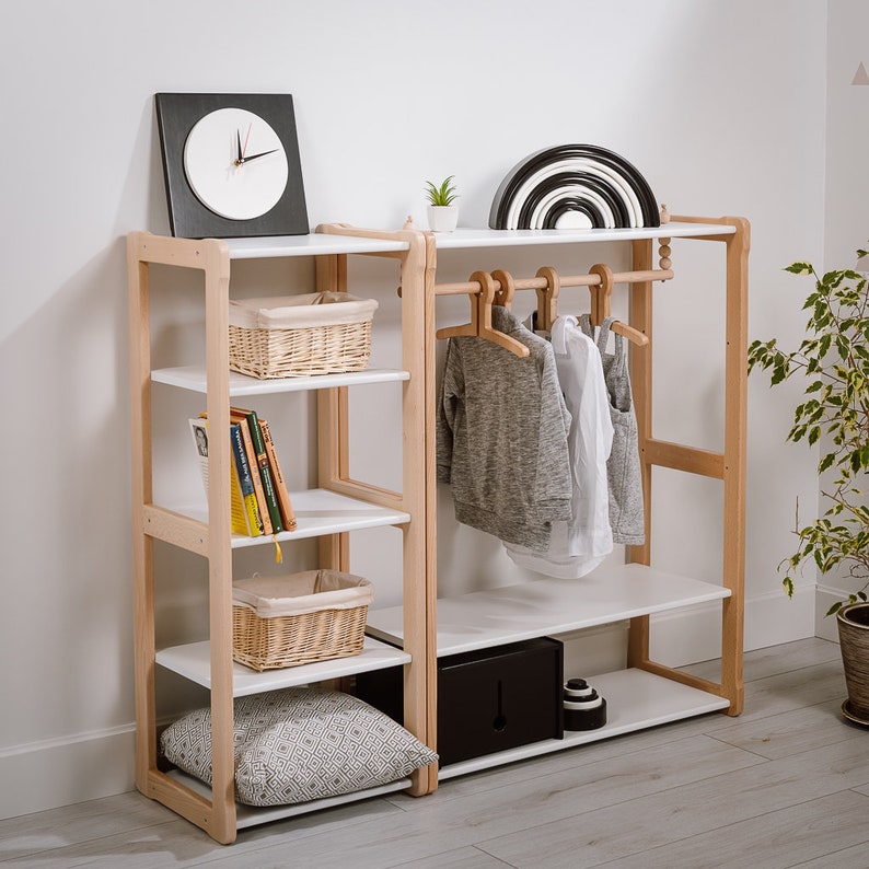 On the picture is a combination of our Montessori Type B clothing rack with our MAXI shelf. The wardrobe has a shelf on the bottom and a stylish hanger holder. Our Maxi shelf has the same height, 4 compartments, where you can store other necessities.
