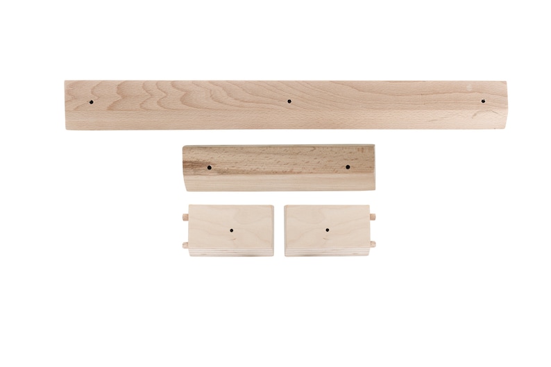 May include: A set of three wooden shelves, each with a simple design and a natural wood finish. The shelves are ideal for displaying small items or organising a workspace.