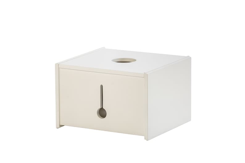 May include: White rectangular box with a round hole in the top and a rectangular slot in the front. The box is made of wood and has a smooth finish.