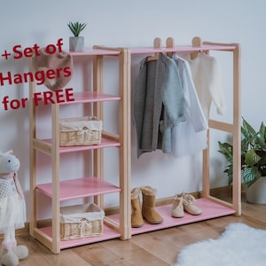 On the picture is a combination of our Montessori Type A clothing rack with our MAXI shelf. The wardrobe has a stylish hanger holder on the top, where the hangers can go. Our Maxi shelf has the same height, 4 compartments.