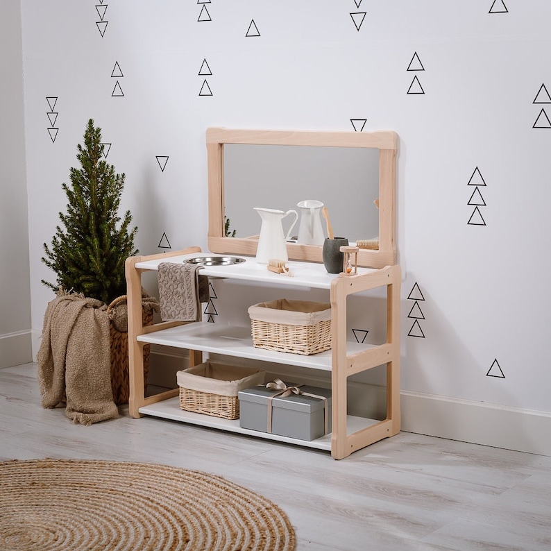 On the picture is our Type A+ washbasin shelf, which can be used by children without having to stand on a stool. This shelf has 2 compartments and on the top is a bowl and a slit, where you can put a towel, above is also a big mirror.