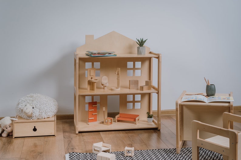 On the picture is our KIKI dollhouse, with a unique design, which let's children to play with dolls. After your child is a toddler the dollhouse can be used as a shelf for books, photos or other items.