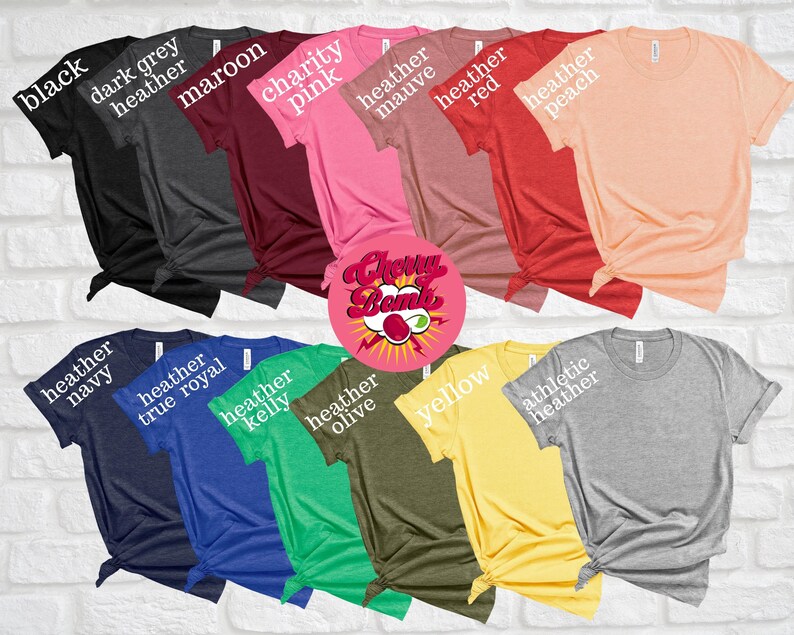May include: A collection of various colored t-shirts, including black, maroon, and yellow. Each shirt is displayed with its color name in white text. The image also features a circular logo with the text "Cherry Bomb".