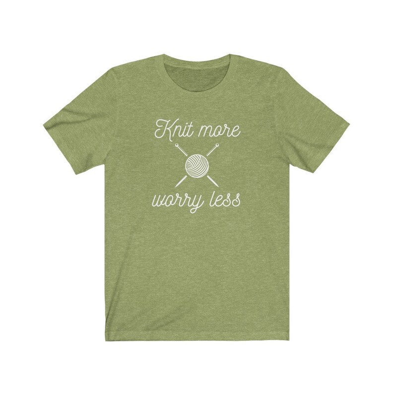 May include: Green t-shirt with white text that reads "Knit more worry less" and a graphic of a ball of yarn with knitting needles.