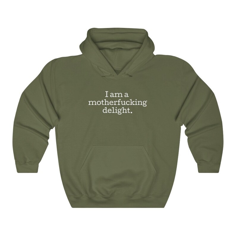 May include: A green hooded sweatshirt with the text "I am a motherfucking delight." printed in white on the front.