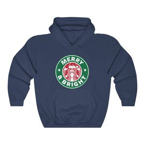May include: Navy blue hooded sweatshirt with a green and white logo that says "Merry & Bright" with a Starbucks logo with a woman wearing a Santa hat.