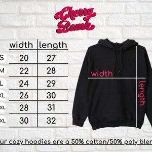 May include: Size chart for a black hooded sweatshirt with measurements in inches for width and length. The chart shows sizes S through 3XL. The text "Our cozy hoodies are a 50% cotton/50% poly blend" is at the bottom of the chart.