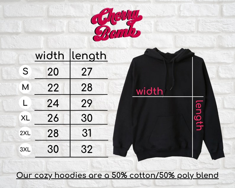 May include: Size chart for a black hooded sweatshirt with measurements in inches for width and length. The chart shows sizes S through 3XL. The text "Our cozy hoodies are a 50% cotton/50% poly blend" is at the bottom of the chart.
