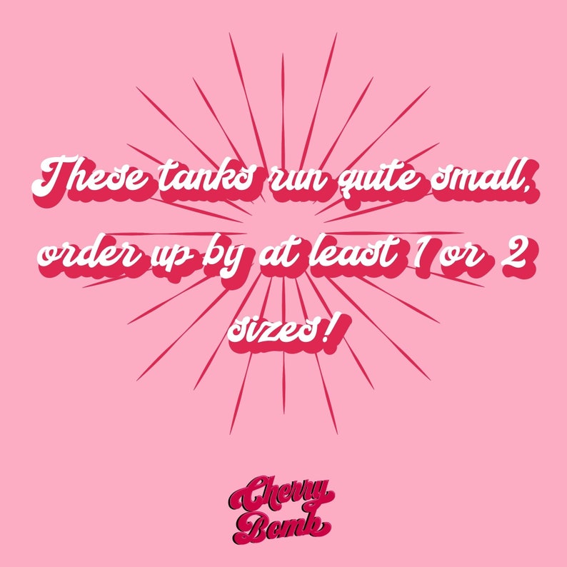 May include: Pink background with red radial lines emanating from the center. Text in white with a red outline reads, "These tanks run quite small, order up by at least 1 or 2 sizes!" The Cherry Bomb logo is at the bottom.