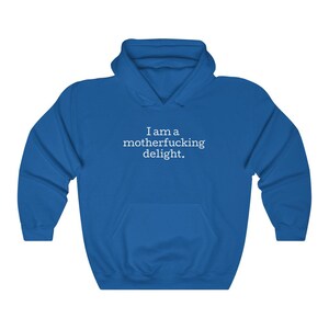 May include: A royal blue hooded sweatshirt with the text "I am a motherfucking delight." printed in white on the front.