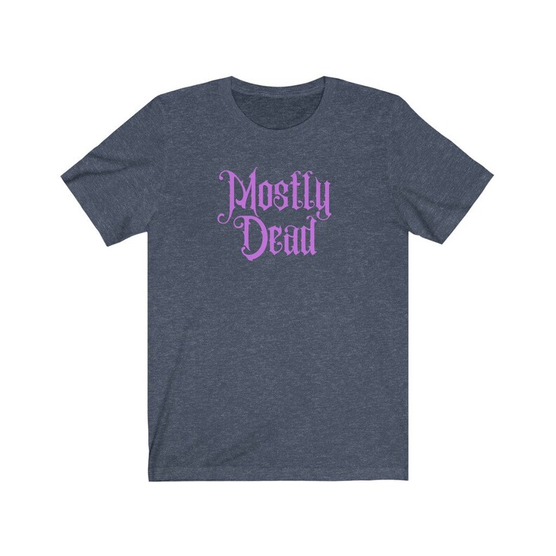 May include: A dark blue t-shirt with a purple graphic that says "Mostly Dead" in a gothic font.