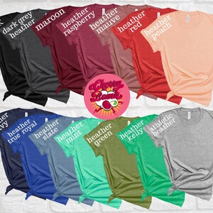 May include: A collection of various colored t-shirts, including black, dark grey heather, maroon, heather raspberry, heather mauve, heather red, and heather peach. Additional colors are heather navy, heather true royal, heather slate, heather mint, heather green, heather kelly, and athletic heather.