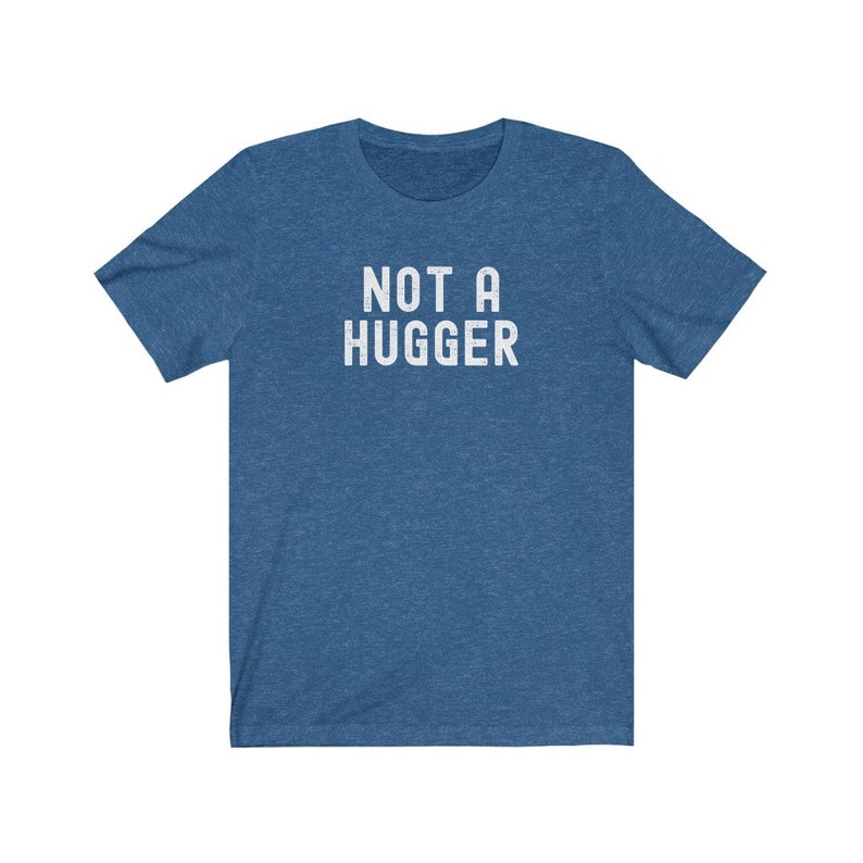 May include: A blue t-shirt with the text "NOT A HUGGER" printed in white.