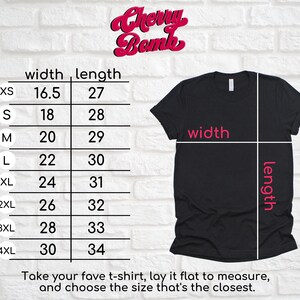 May include: A size chart for t-shirts with measurements in inches for width and length. The chart shows sizes XS through 4XL. The text "Cherry Bomb" is at the top of the chart.