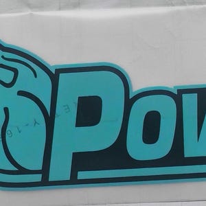 May include: A teal and black sticker with the text "U. Power" and a roaring lion graphic. The lion is teal with black outlines, and the text is teal with black borders. The sticker is on a white background.
