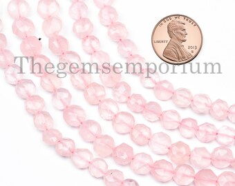 May include: A strand of pale pink faceted rose quartz beads. The beads are approximately the size of a UK penny.