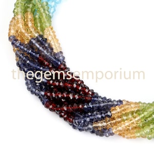 May include: A strand of faceted gemstone beads in a rainbow of colors, including green, yellow, blue, red, and purple. The beads are arranged in a spiral pattern.