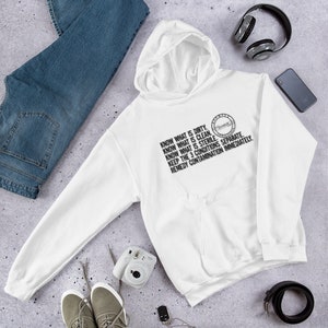 May include: A white hoodie with a front pocket and a hood with a drawstring. The shirt has black text that reads "KNOW WHAT IS DIRTY. KNOW WHAT IS CLEAN. KNOW WHAT IS STERILE. KEEP THE 3 CONDITIONS SEPARATE. REMEDY CONTAMINATION IMMEDIATELY."