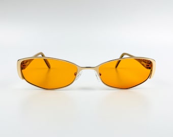 Vintage zonnebril uit de jaren 90 – NOS goudkleurig metalen montuur en oranje lenzen – Made in Italy