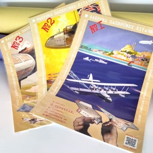 Könnte beinhalten: Drei Vintage-Papierflugzeug-Bausätze mit bunten Illustrationen. Die Bausätze sind mit den Nummern 1, 2 und 3 gekennzeichnet. Die Bausätze zeigen Bilder von Flugzeugen, einer Skyline und einer Karte. Die Bausätze wurden in der UdSSR hergestellt.