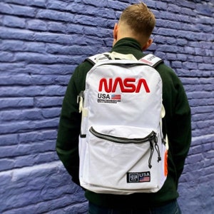 バックパック NASA ホワイト、ホワイト バックパック、バックパック、飛行機、航空機、航空、旅行、NASA 宇宙ロゴ、機内持ち込みバックパック、天文学、最高のギフト