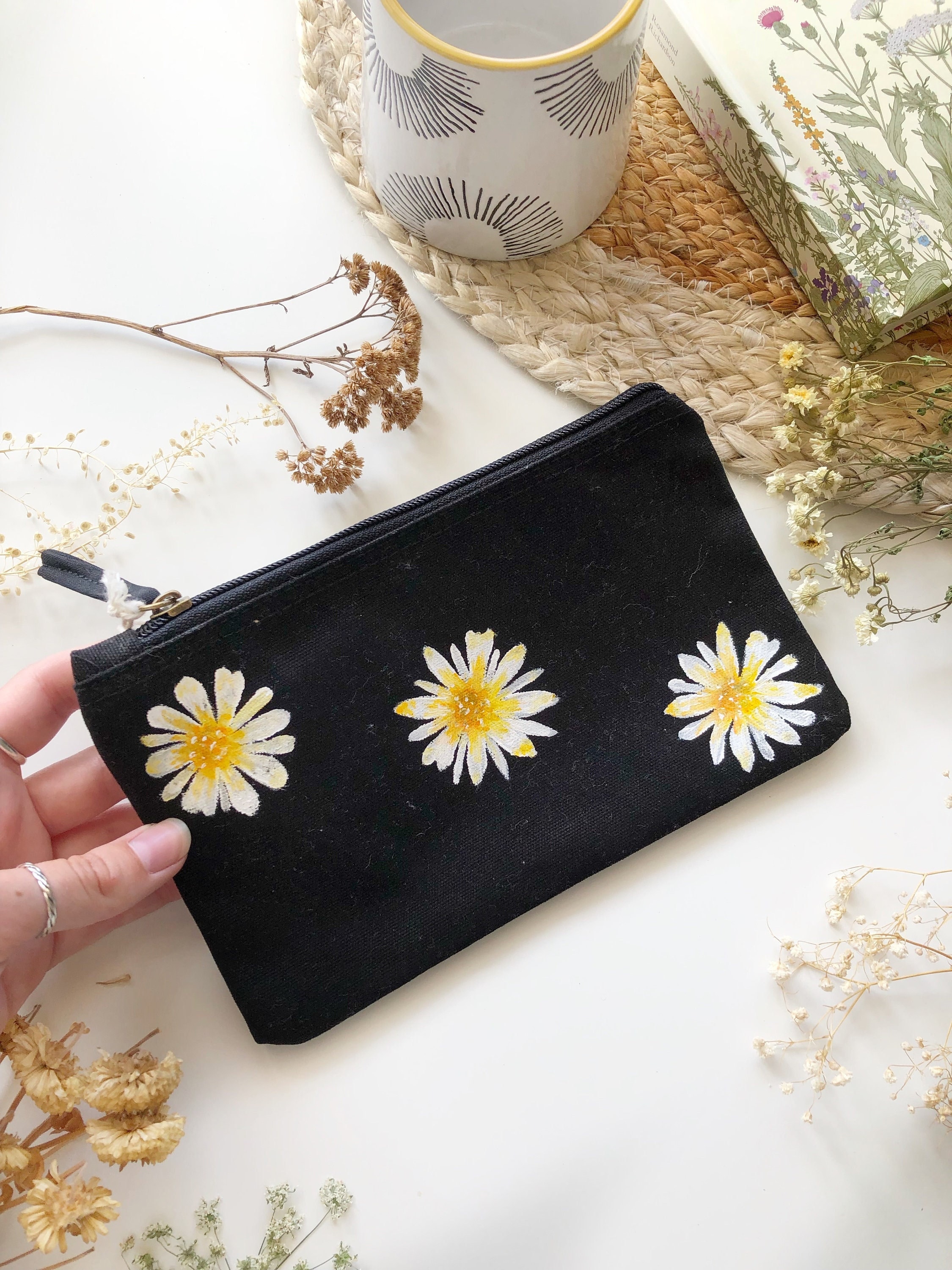 Daisy outlet clutch bag