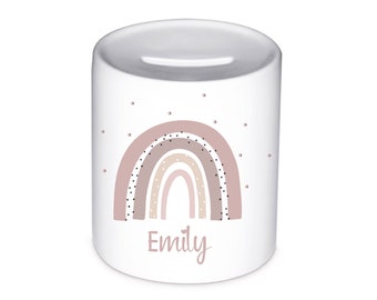 May include: White ceramic money box with a pink and brown rainbow design and black polka dots. The name "Emily" is written below the rainbow.