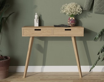 Narrow wood console table with drawers in modern mid century design. Small, skinny, minimalist design