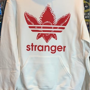 Stranger things***HOODIE*** with demogorgon design can be made any color hoodie and/or any color design (pictured white hoodie w/red design)