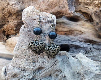 Bronze earrings with bronze pendants and with wooden beads