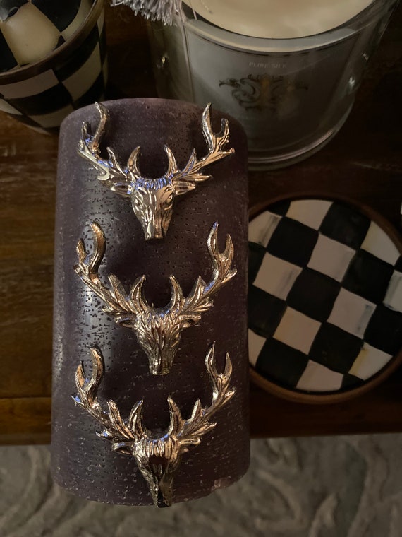 Three large stag candle pins