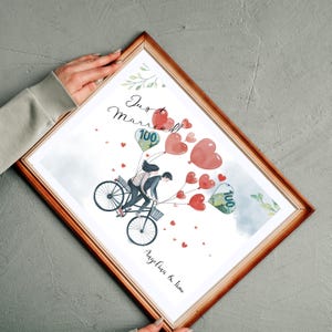 May include: A watercolor illustration of a couple riding a bicycle with red heart balloons. The balloons are filled with money, and the text "Just Married" is written above the couple. The couple's names, "Angelina & Jim", are written below the bicycle.
