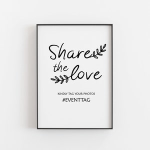 May include: Black and white sign with the text "Share the love" and a floral design. The sign also includes the text "Kindly tag your photos #EVENTTAG".
