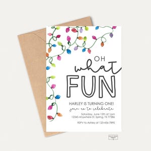 May include: White invitation card with the text "OH what FUN" and colorful string lights. The card announces Harley's first birthday, including date, time, location, and RSVP information. A brown envelope is behind the card.