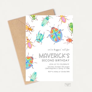May include: A watercolor birthday invitation featuring colorful beetles on a white background. The invitation reads "we're buggin' out for MAVERICK'S SECOND BIRTHDAY" with event details. A brown envelope is behind the invitation.