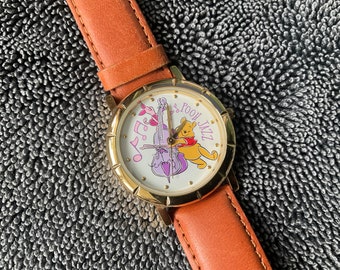 Vintage collectible 1990’s Timex Disney Winnie the Pooh and Piglet Jazz Musical watch, water resistant, in original box, working order.