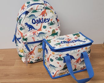 Livraison rapide personnalisé coloré dinosaure sac à dos sac à déjeuner ensemble dinosaure cadeau crèche sac retour à l'école filles sac à dos personnalisé