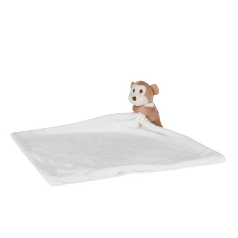 Peut inclure: Une couverture en peluche blanche pour b&eacute;b&eacute; avec un singe brun attach&eacute;. Le singe sort de sous la couverture.