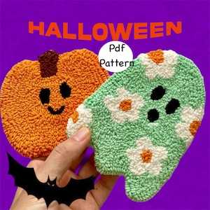 May include: Two Halloween-themed punch needle patterns, a pumpkin and a ghost, with a black bat silhouette in the foreground. The text "Pdf Pattern" is visible in a white circle.