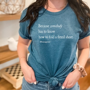 Enneagram Type 1 T-Shirt. Because Somebody Has To Know How To Fold A Fitted Sheet T-shirt. Funny Enneagram T-shirts. Enneagram Gift. image 1