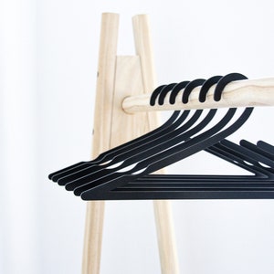 Metal hangers made from sustainable materials for home interior