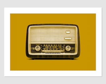 May include: A vintage-style radio with a brown and cream color scheme. The radio has a dial with numbers and a speaker grille. The radio is set against a yellow background.