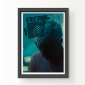May include: Framed art print featuring a teal and blue color palette. The image depicts a person in silhouette, with the text "BLADE RUNNER" in a teal box. The artwork has a moody, atmospheric quality.