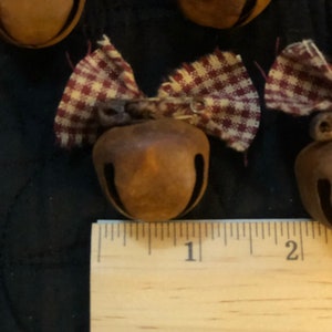 Primitive Christmas ornies Set of 8 rustic 1” bells with homespun and rustic pin