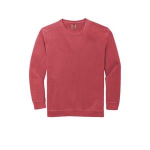 May include: A long-sleeved, red crew neck t-shirt with a faded, vintage look.