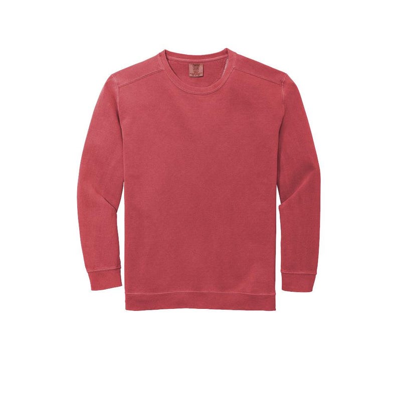 May include: A long-sleeved, red crew neck t-shirt with a faded, vintage look.
