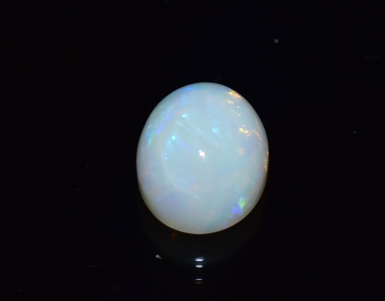 Ring Size White Base Opal With Multi Fire Earth Mined Stones 9x7 MM Oval Shape 1.70 Carats Natural Ethiopian Opal Blazing Fire.