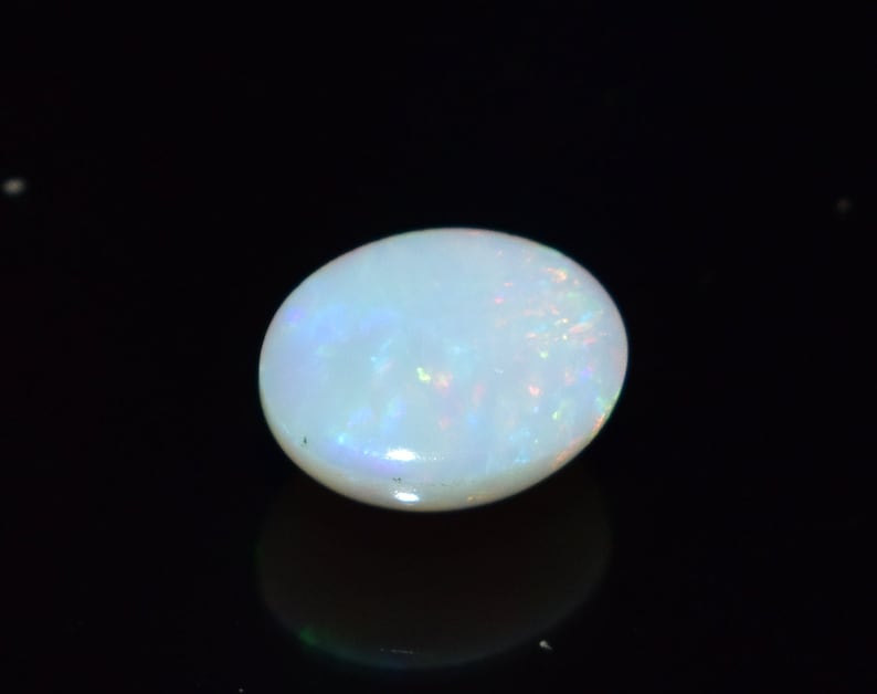 Ring Size White Base Opal With Multi Fire Earth Mined Stones 9x7 MM Oval Shape 1.70 Carats Natural Ethiopian Opal Blazing Fire.