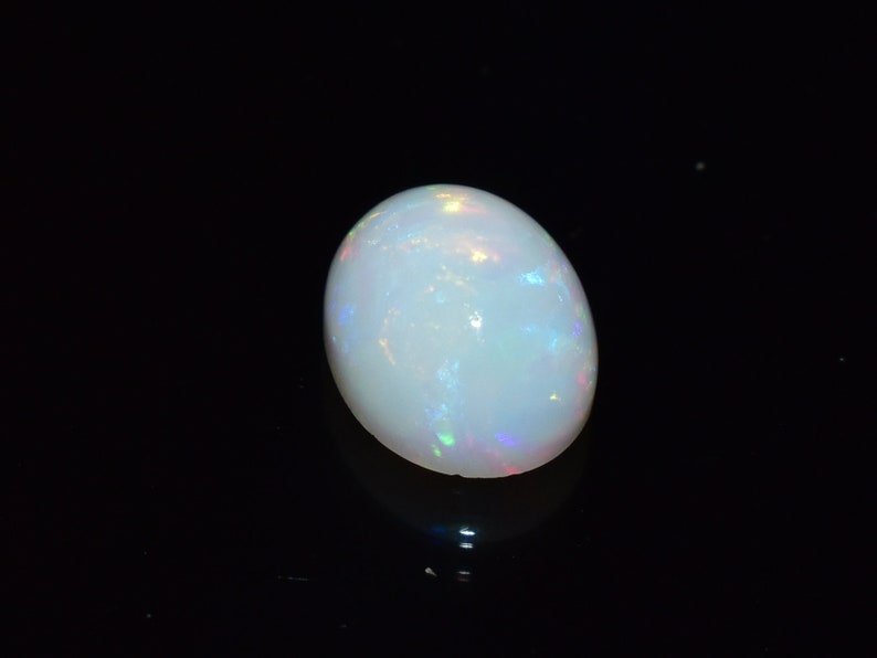 Ring Size White Base Opal With Multi Fire Earth Mined Stones 9x7 MM Oval Shape 1.70 Carats Natural Ethiopian Opal Blazing Fire.